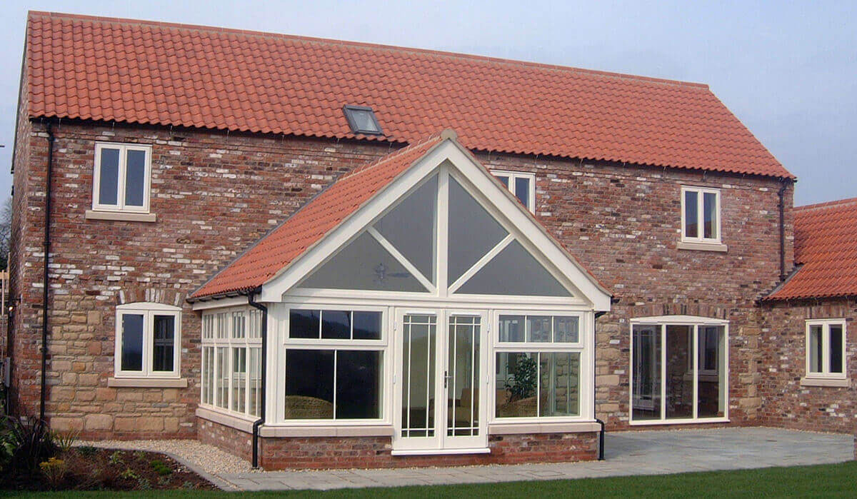 White wooden triangular windows.